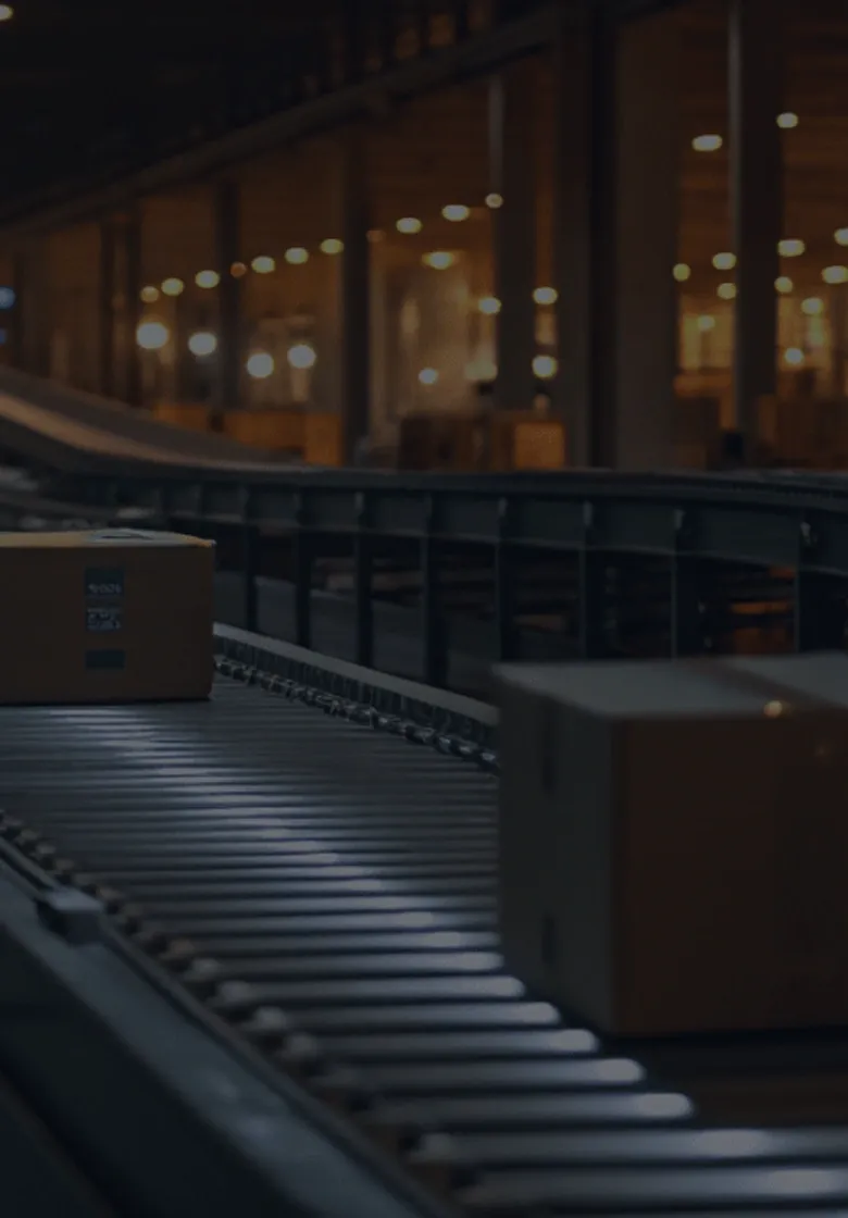 Automated conveyor system transporting packages in a logistics warehouse